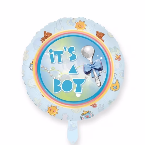 Balon din folie rotund cu fundal albastru deschis avand central mesajul It's a Boy cu litere albastre alaturi de un ac de siguranta cu fundita albastra si margini decorate cu ursuleti soare zambitor si suzete