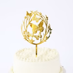 topper tort happy birthday auriu Topper decorativ pentru tort, mesaj Happy Birthday, culoare auriu oglindat, material plexiglass premium. Design elegant ce ilustreaza o coronita din ramuri delicate si fluturi.