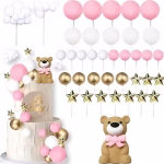 Set complex de decoratiuni tip topper tort incluzand figurina ursulet cu funda roz bile asortate stelute aurii si norisori albi pufosi