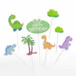 Set 8 Toppere Tort Dinozauri Set de 8 toppere din carton pentru tort cu dinozauri simpatici colorați, palmier, arbuști și mesaj Happy Birthday verde.
