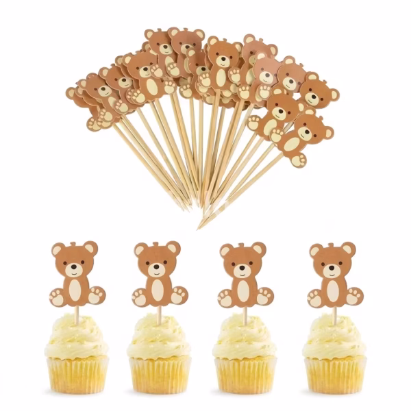 Set 10 Toppere Decorative Ursuleți Brioșe Set de 10 toppere decorative din carton pentru brioșe și tort, în formă de ursuleți maro simpatici, montați pe scobitori din lemn.