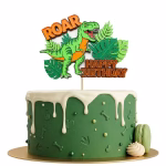 topper tort happy birthday dinozaur Topper de tort Happy Birthday din carton cu tematică dinozauri, ilustrând un T-Rex verde, frunze tropicale și textul ROAR, așezat pe un tort tematic.