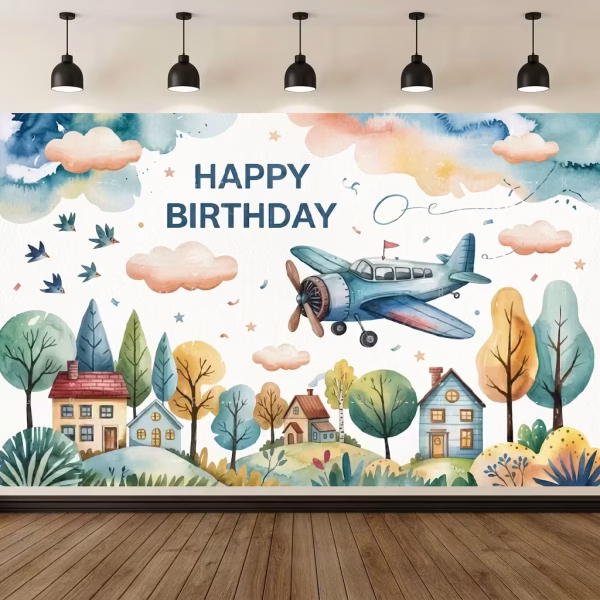 Background Textil Avioane Cod 774B Mockup cu un background textil pentru panou foto cu tematica avioane, ilustrand un peisaj de vis in stil acuarela cu casute colorate, un avion vintage albastru zburand printre nori pastelati, pasari si textul Happy Birthday.
