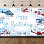 Background Textil Avioane Cod 767B Mockup cu un background textil pentru panou foto cu tematica aviatie, ilustrand avioane, elicoptere si baloane cu aer cald zburand printre nori pe un cer in carouri albastru deschis, avand textul Happy Birthday in centru.