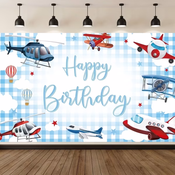 Background Textil Avioane Cod 767B Mockup cu un background textil pentru panou foto cu tematica aviatie, ilustrand avioane, elicoptere si baloane cu aer cald zburand printre nori pe un cer in carouri albastru deschis, avand textul Happy Birthday in centru.