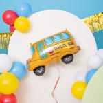 Balon Folie Autobuz Scolar 68x51 cm Balon din folie in forma de autobuz scolar integrat intr-un decor festiv cu baloane multicolore.