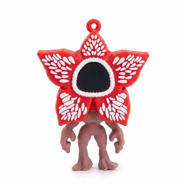 Figurină 3D pentru tort, reprezentând monstrul Demogorgon din Stranger Things, cu fața deschisă sub formă de petale cu colți.