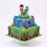 Set 2 Figurine Topper Tort Sonic și Knuckles Set de 2 figurine 3D din plastic necasant pentru topper tort, reprezentând personajele Sonic și Knuckles, așezate pe un tort tematic inspirat din jocul video.