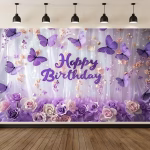 Mockup cu un background textil pentru panou foto ilustrand un design elegant cu fluturi mov in zbor textul Happy Birthday si un aranjament bogat de trandafiri pastelati pe un fundal tip perdea.