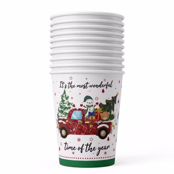 Pahar din carton de 250 ml cu fundal alb, ilustrand o camioneta rosie clasica incarcata cu un brad, un om de zapada, un ursulet, cadouri si mesajul It's the most wonderful time of the year