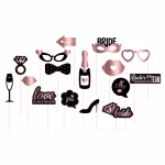 Set de 16 elemente de recuzita foto din carton cu tematica hen party, in nuante de rose gold si negru, incluzand inel de logodna, sticla de sampanie, pahar, pantof cu toc, buze si mesaje precum Bride si Bride's Drinking Team